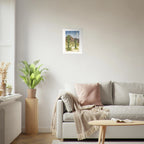 Fine art print by Houston based artist Jenny Wagner, Desert Moon. This watercolor print depicts a desert scene with saguaro cacti and a full moon in the background. Print shown on a neutral living room wall