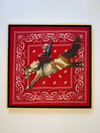 Hold On painting by Texas artist Jenny Wagner shown in its frame, a bronc rider is shown mid buck and painted on a red bandana