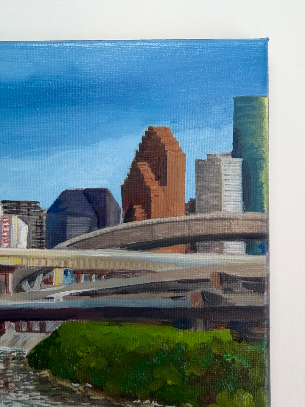 Textured oil painting detail showing Houston skyscrapers, elevated highways, and blue sky