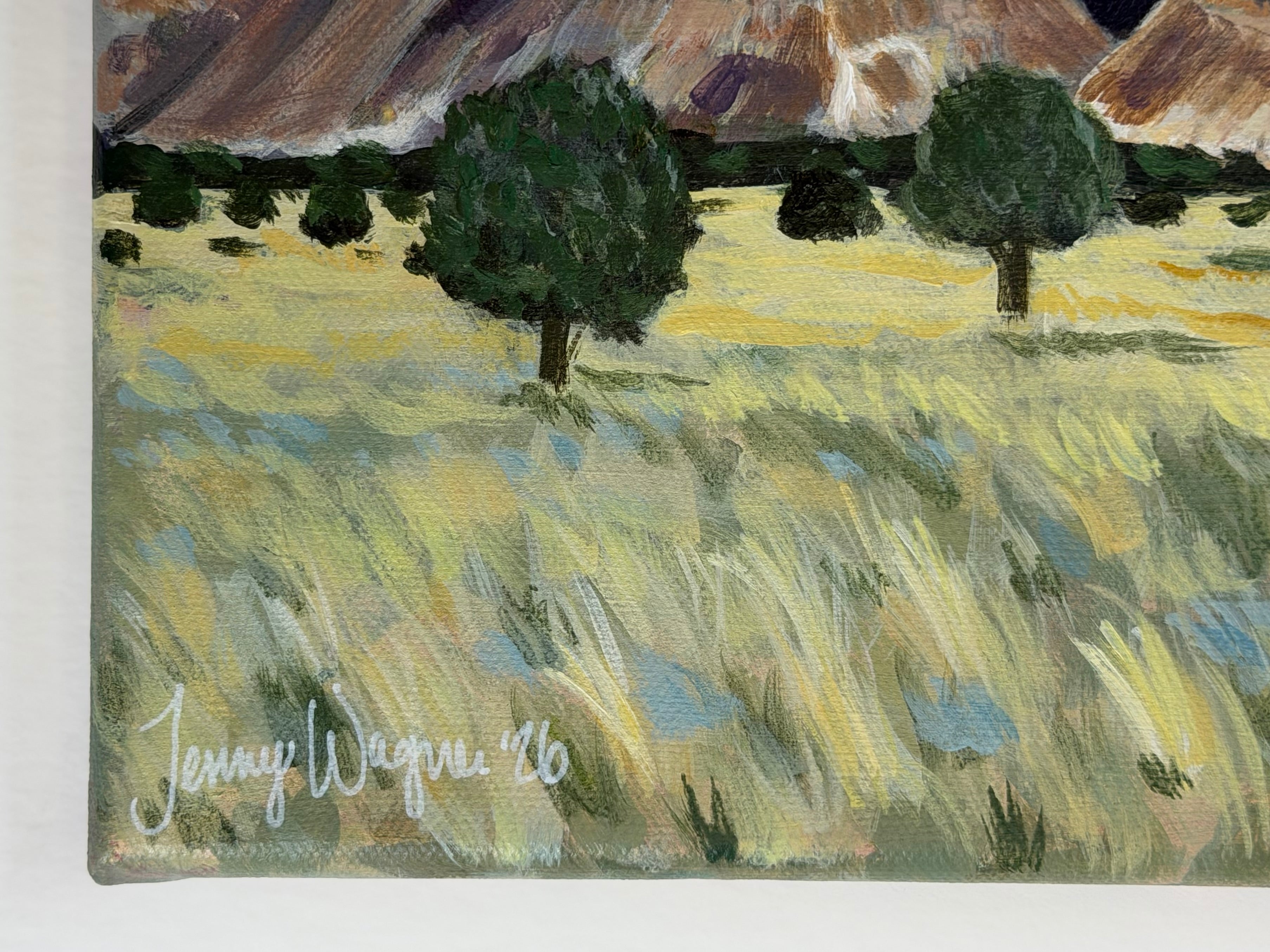 Close up on artist signature of the original 10x10 acrylic landscape painting "Colorado to Utah" by Texas artist Jenny Wagner