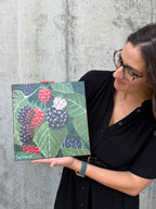 Jenny Wagner displaying the original botanical paining "Wild Blackberries"